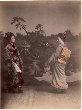 1913 Japan – Two young women playing hanetsuki (badminton/battledore/shuttlecock), studio...