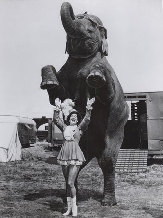 232 Circus Girl Trainer with Elephant. Photographer Unknown